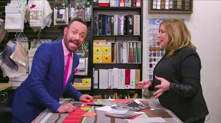 Nick Verreos going over designs with blonde woman