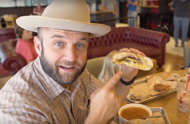 Chet Garner enjoying a sandwich on his road trip