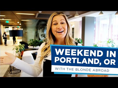 Blonde in white shirt and black overalls