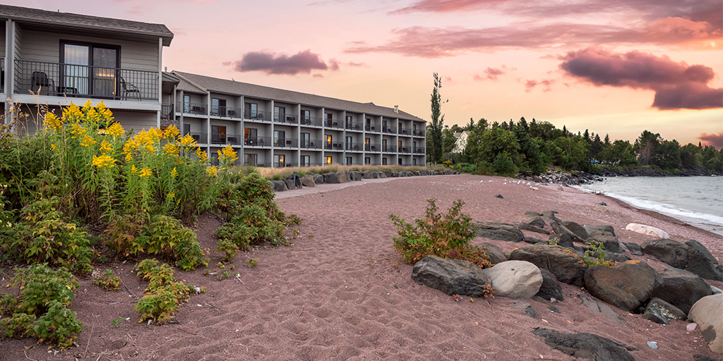 Mult-floor hotel at the edge of a beach and water in Minnesota