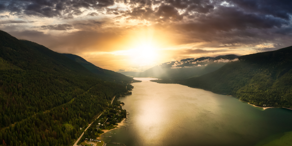 Aerial Panoramic View of Kootenay River during a cloudy summer sunrise. Taken near Nelson, British Columbia, Canada.