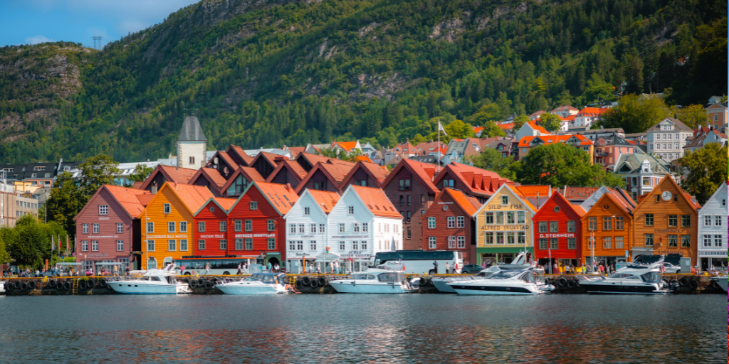 Bright buildings line waterfront in Norway