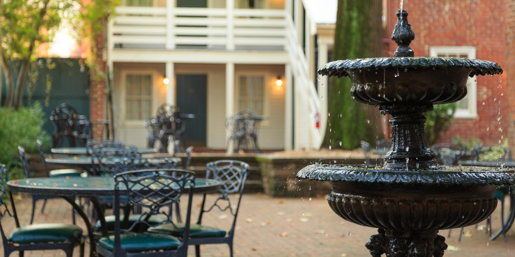 Exterior fountain of a brick facade hotel