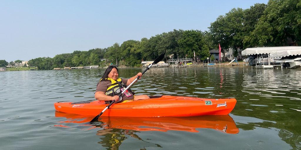 Woman kayaks in Minnesota